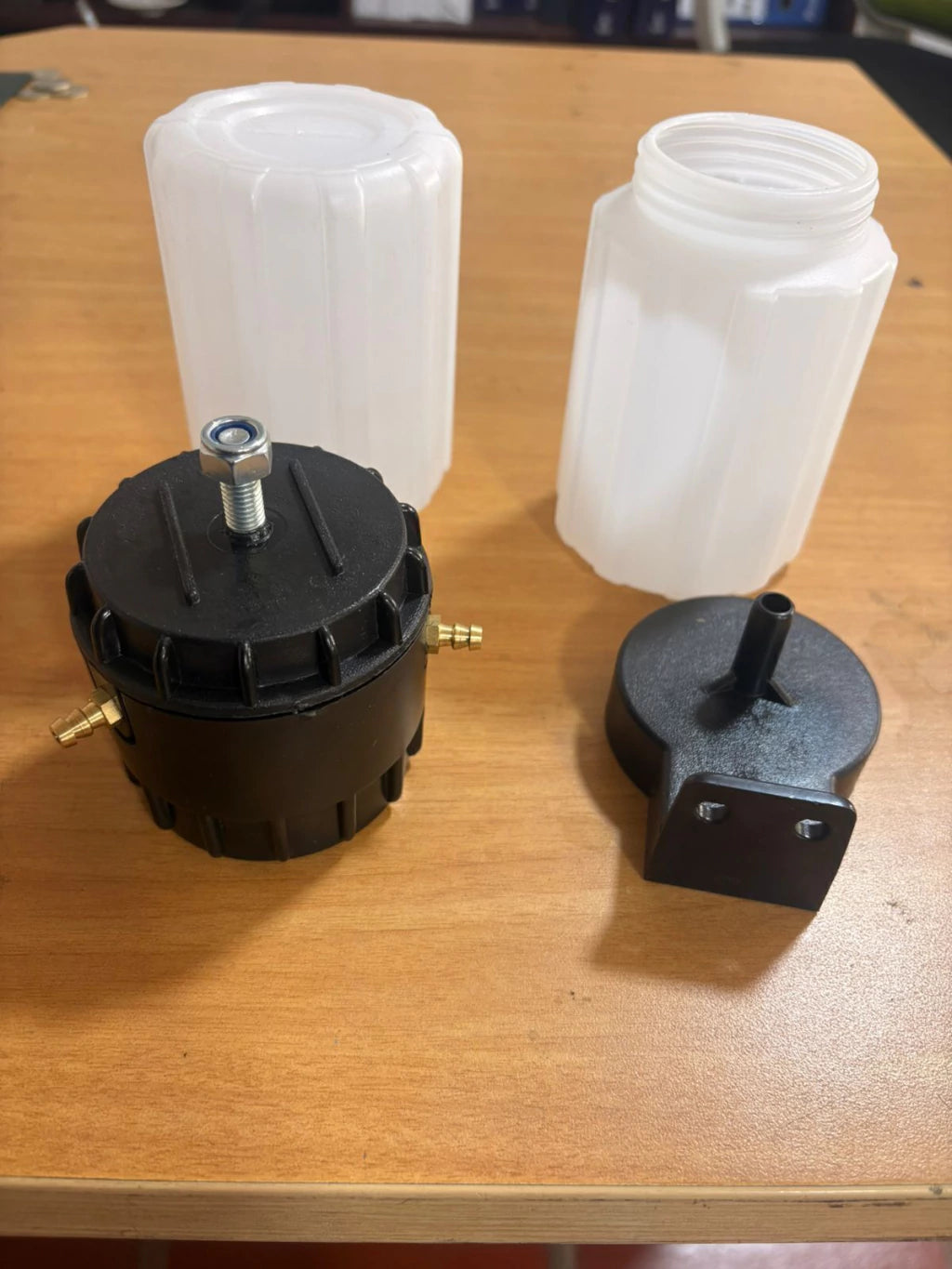 Aceitera para bomba de vacío de ordeño